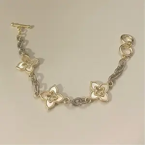 14k Gold Dipped 3 Clover Mother of Pearl Two Tone Toggle Clasp Bracelet with Elegant Floral Design and Toggle Clasp Closure