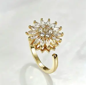 2026 New Spinning Chrysanthemum Ring - The perfect gift to ease anxiety, great for couples, friends, and family. Features a spinning flower, adjustable band, shiny gold finish, stylish and playful jewelry, perfect for gifting.