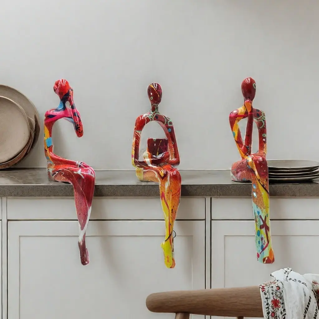 Three-piece set of abstract art figurines depicting seated figures—light luxury decor for the living room, entryway, and wine cabinet; suitable for art enthusiasts.