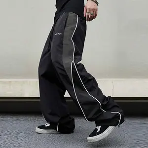 Men’s letter-print side-striped drawstring pants, casual loose pocket pants with an adjustable elastic waistband, suitable for everyday wear; fashionable sports pants.