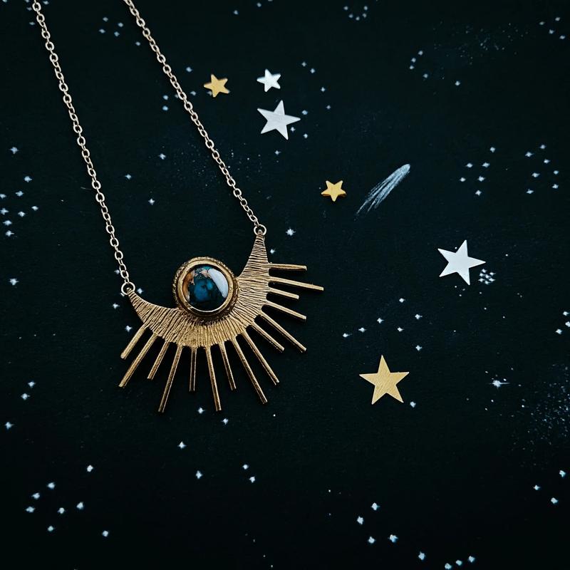 Celestial Jewelry Collection Gold Sun Pendant with Blue Stone Necklace for Women Cosmic Aesthetics Versatile Designs Perfect for Any Occasion