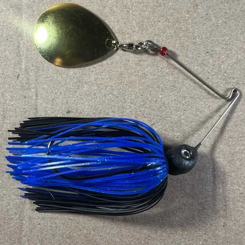 039 Custom Bingo Spinnerbait, 1/2oz Black/Blue Pepper Night Thumper Single Colorado Gold Blade with 80-Strand Tournament-Grade ProUmbrella Skirt, Brass-Based Premium Components, Hand-Crafted in Texas, USA.