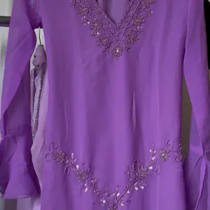 Purple 90s Kurti with Embroidered Details and Flowing Fabric