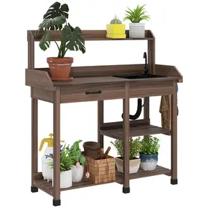 Spacious desktop outdoor potting work bench with classified storage zones for lawn exterior plant caring and gardening tool arrangement