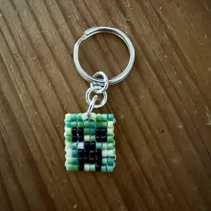 Creeper Keychain Pixelated Gaming Nostalgia 8-Bit Video Game Aesthetic Handmade Beads Unique Gift for Nerdy Culture Enthusiasts