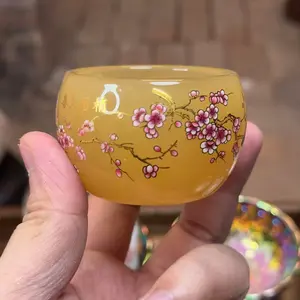 Yellow-painted Night-glow Teacup with Joy Adorning the Plum Branch