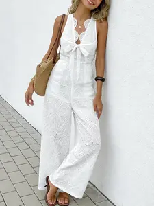 A women's bohemian style white Fitted jumpsuit with a design sense of V-neck bow and sleeveless hollow out fashion vacation Boho style wide leg jumpsuit, suitable for summer, home, indoor, and outdoor wear, Womenswear