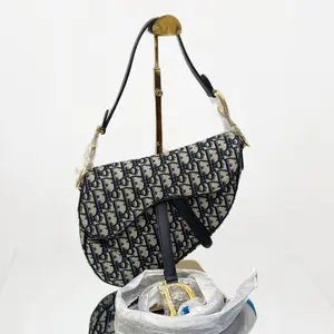 Pre-owned Fabrics Crossbody Bags Dior Saddle Bag in Blue Dior Oblique Jacquard with Antique Gold Tone Hardware