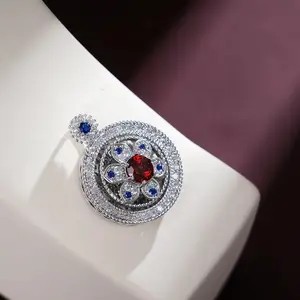 silver rotating pendant in the shape of snowflakes with chains attached