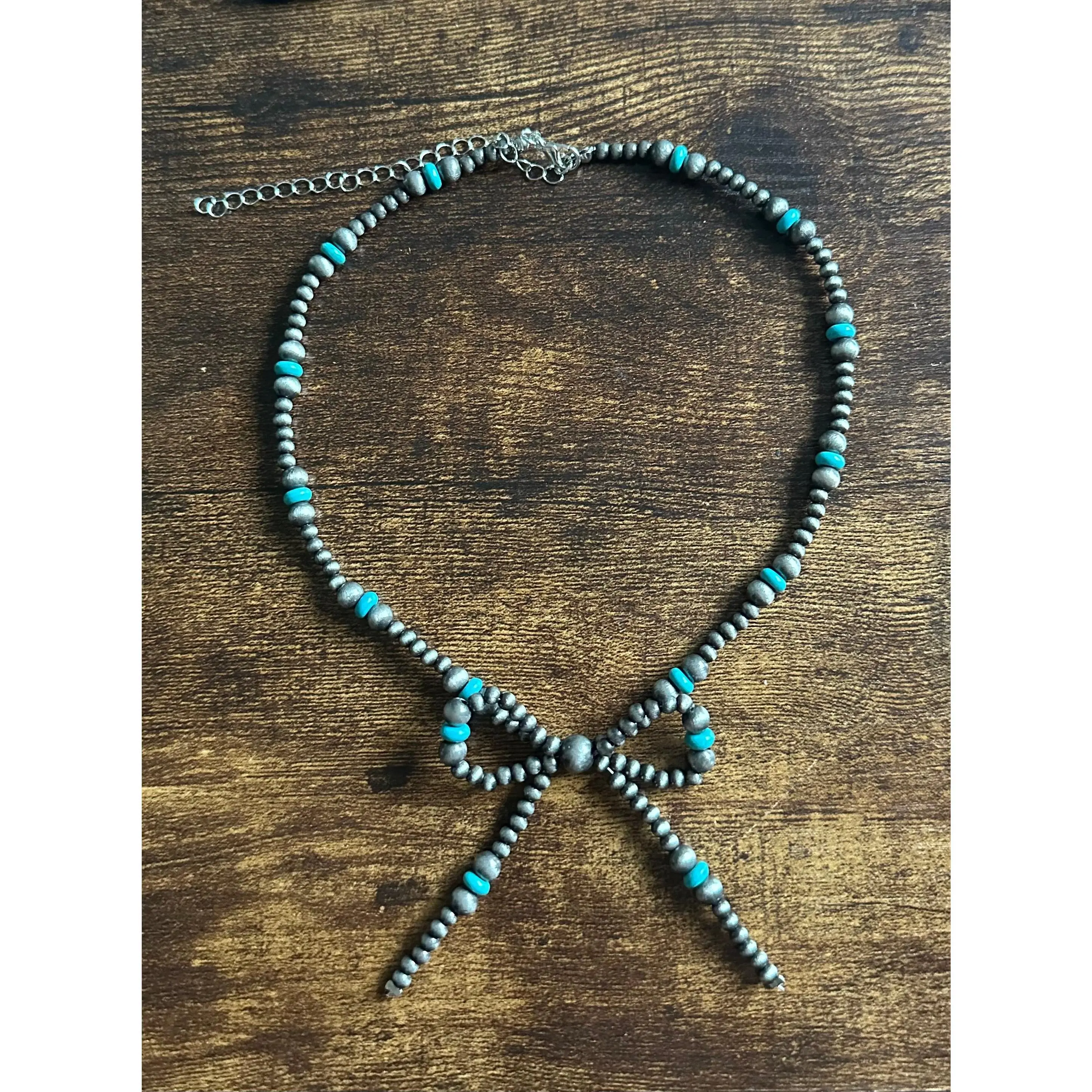 Faux pearl bow necklace