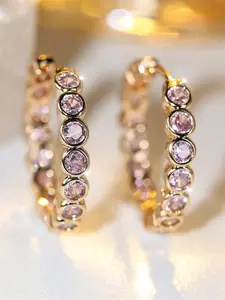 A pair of champagne gold round pink zirconia ring ear buckles are fashionable and simple, suitable for women and perfect as gifts