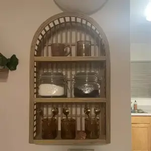 The shelves on the wall display the arched wall of the bedroom, and the multi-layered bookshelf wall hanging creativity