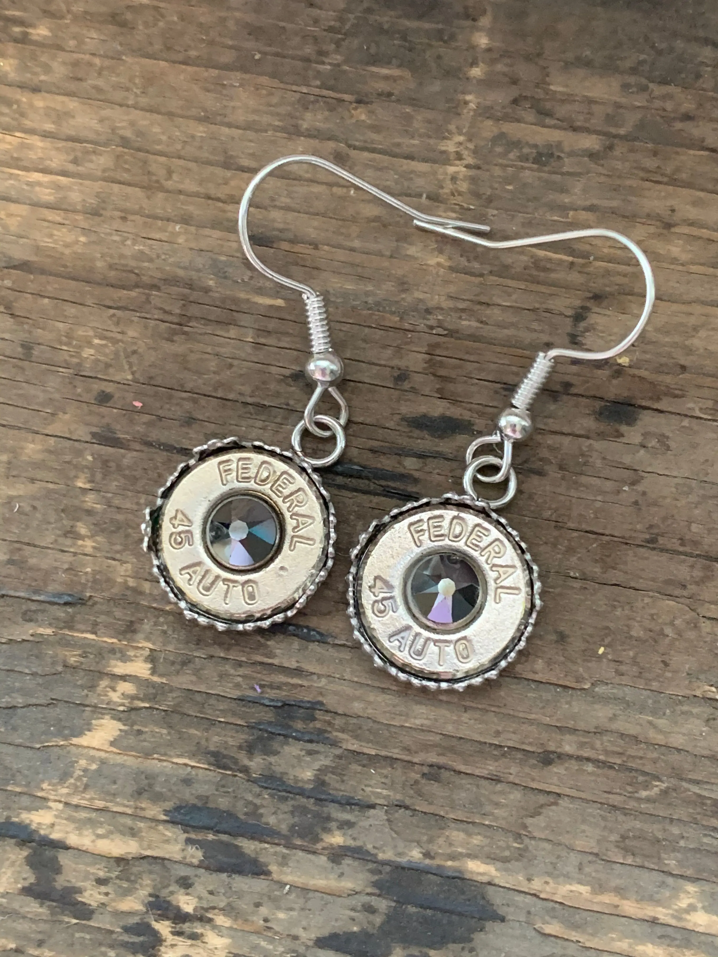 45 caliber jet black filigree rimmed drop bullet earrings