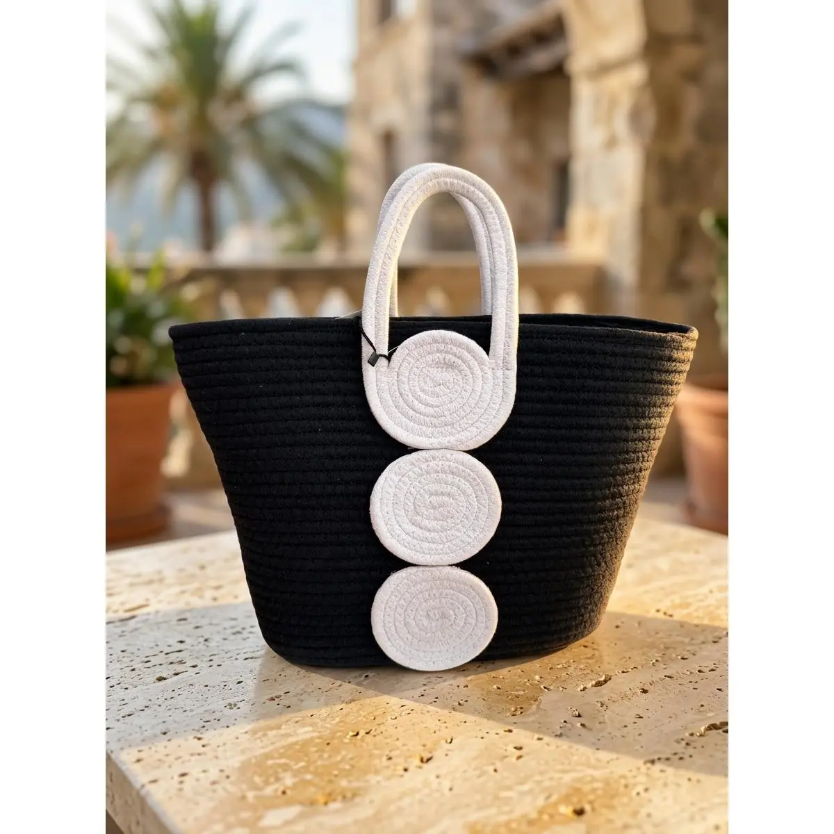 Elegant Black Straw Tote Bag with White Circular Handles for Summer Outings