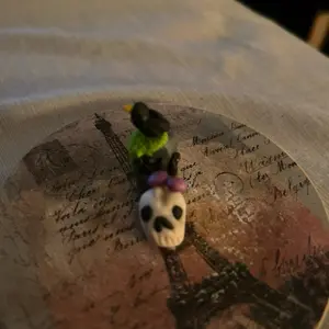 Grave stone and skull clay figure