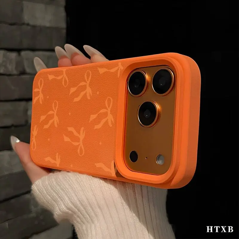 Orange BowThe Stylish And Comfortable Large Perforated Leather Texture Orange Phone Case Is Perfect For A Friend, Significant Other, Or Family Member And Is Compatible With IPhone 17/X/11/12/13/14/15/16 Models, Including Plus, Pro, Max, And SE Versions.
