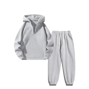 Unisex two-piece sweatshirt set featuring a minimalist solid-color half-zip hoodie paired with loose, breathable vintage-look pants—trendy, stylish everyday outdoor casual wear (SpringStatements).