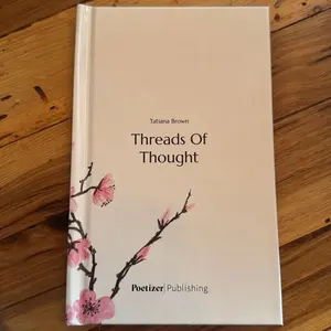 Poetizer Publishing Threads Of Thought by Tatiana Brown - A Book with Floral Design on the Cover