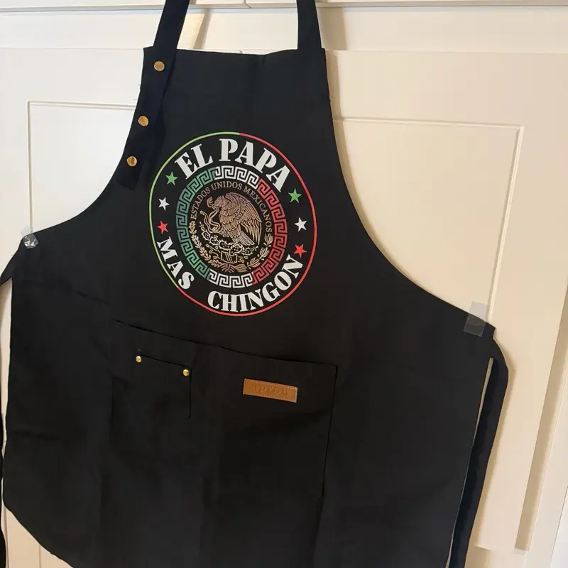 El Papa Mas Chingon Apron For Dad - Black Apron with Pocket and Gold Buttons