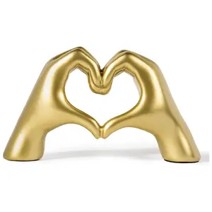 One exquisite handmade resin heart-shaped statue - a modern symbol of love, with a unique hand-shaped design, an elegant home decoration item, a beautiful wedding decoration, suitable for party room decoration, desk decoration.