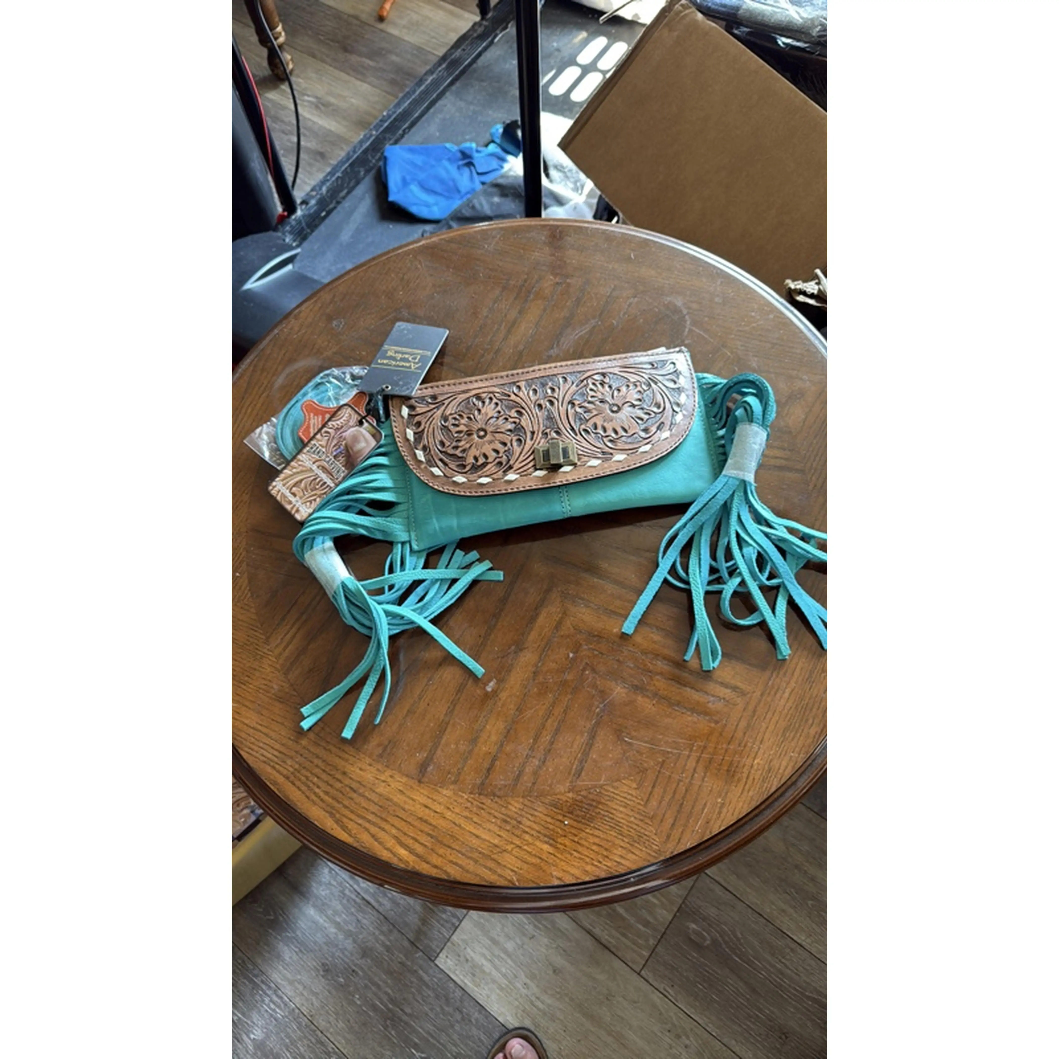 Trendy Teal Fringe Wallet with Intricate Floral Design and Tassels for Stylish Storage