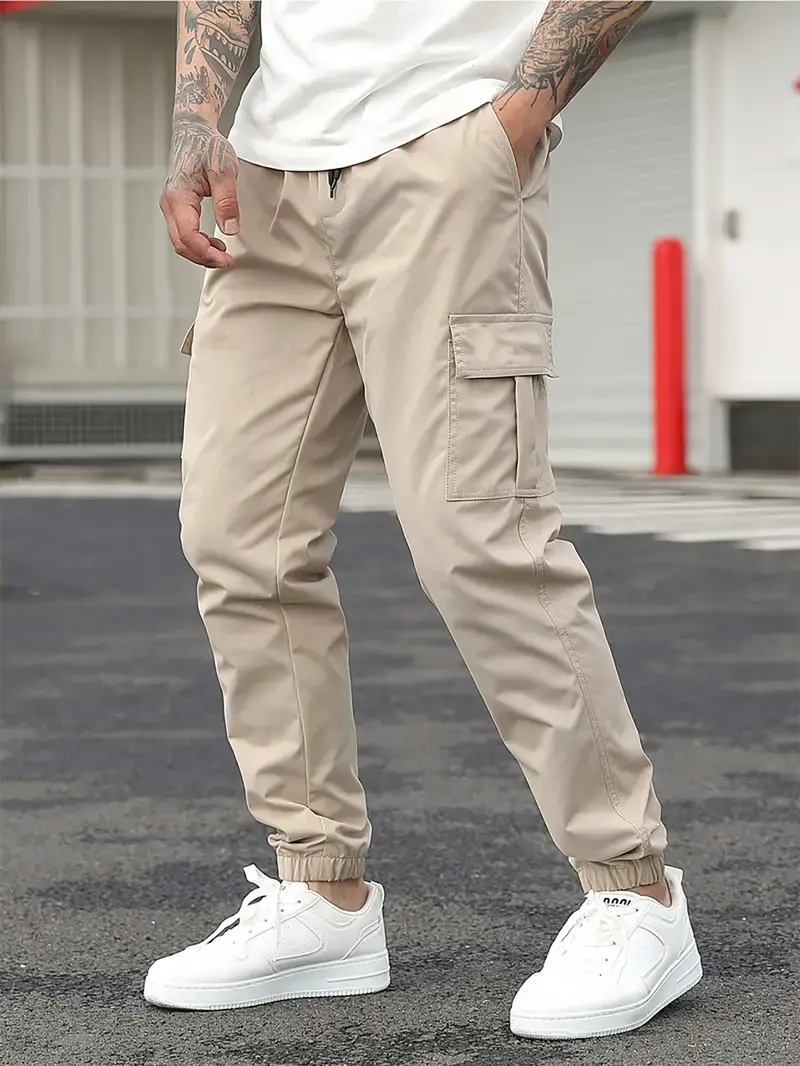 Men's durable work pants with multiple pockets; outdoor sports pants; cargo pants with drawstring design; tapered men's pants; machine washable; holiday gift.
