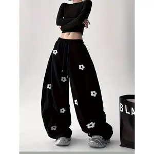 Girls' Wide-Leg Pants with Floral Pattern - Elastic Waist, Comfortable Stretch Fabric, All-Season Casual Trousers for Teens & Young Children, Black with White Floral Design, Perfect for Casual Attire, Comfortable Clothing |   Floral Pattern Pants |   Stre