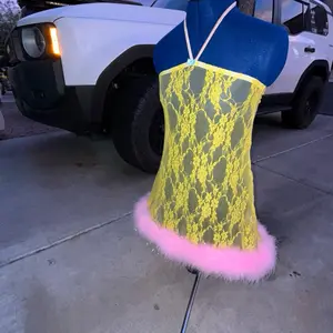 Pink lemonade lace dress with ostrich feathers