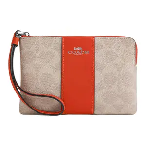 COACH Corner Zip 16 Logo Wristlet with Coated Canvas and Leather in Sand and Deep Orange for Women