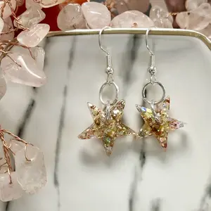 Shiny gold small resin star earrings