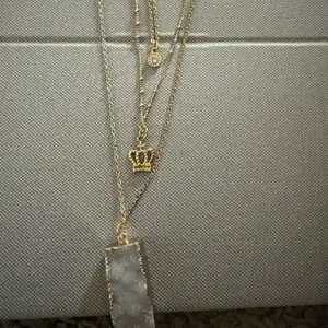 Three Layer Necklace with Customizable Charms Including Crown and Stone Pendant in Gold Tone