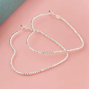 Renza Hook Earrings - Women's Heart-Shaped Diamond-Cut Silver Accessory