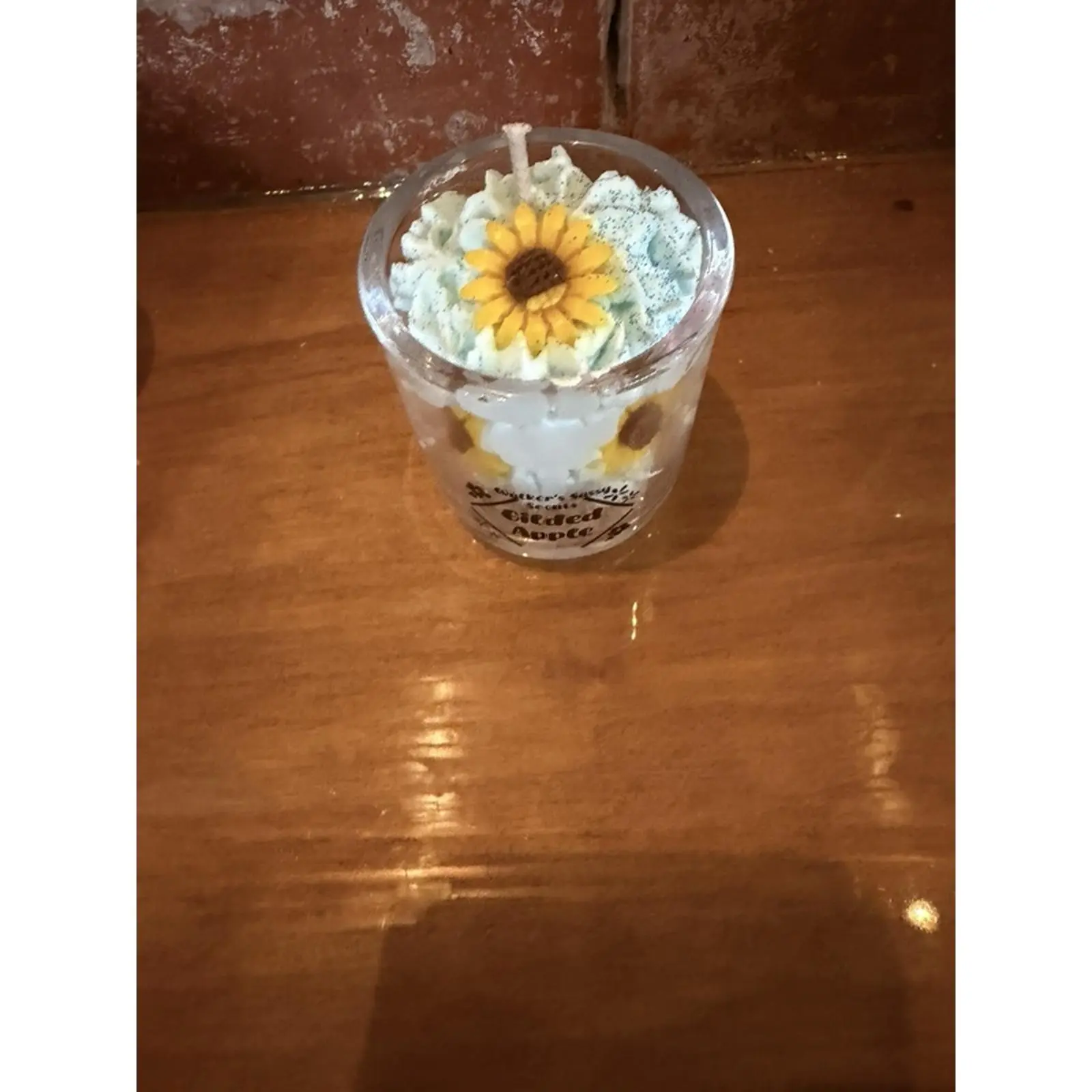 Gilded Apple Scented Sunflower Candle in Clear Container with Yellow Flower Design