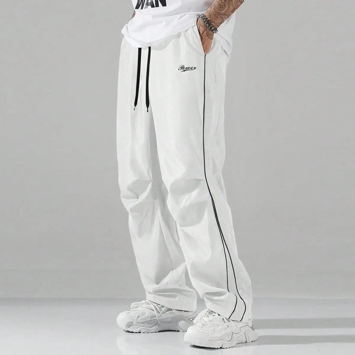 Men's Dark Grey Striped Full-Length Chic Basics Track Pants - Lightweight Quick-Dry Fabric, Elastic Waist with White Drawstring, White Side Stripe, "Power" Logo, Loose-Flowy Contemporary Baggy Streetwear Fit, Ideal for Casual Urban Outings, Polyester