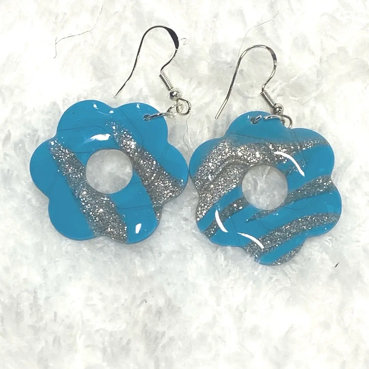 Handmade Blue polymer clay dangle hook earrings with silver glitter and a top coating of resin