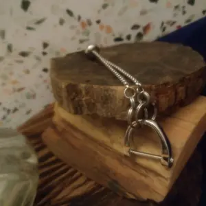 Shacklewear Bracelet with Silver-Tone Finish, Adjustable Chain, and Decorative Bead