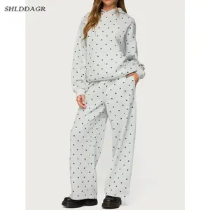 Women's white polka dot long-sleeved hoodie and pants set, loose and comfortable fit for autumn and winter.