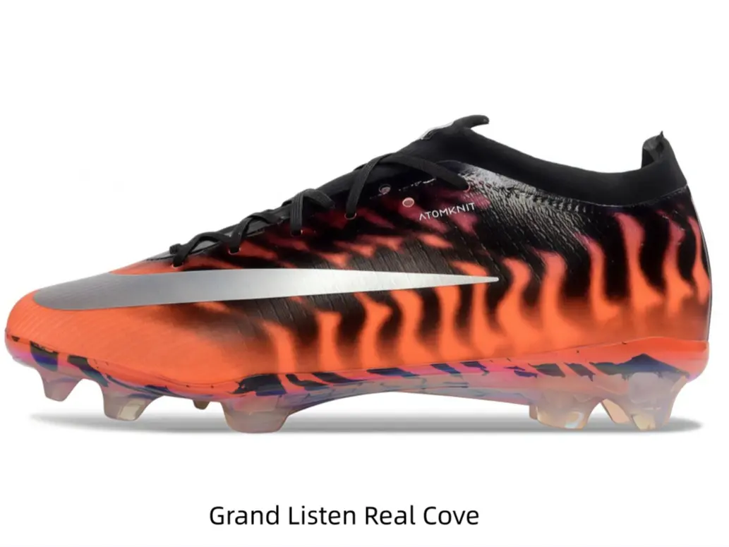 Fiery orange tiger stripe soccer cleats with metallic silver graphic & translucent studs