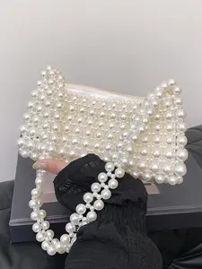 Underarm bag with a niche personality, decorated with a full pearl body, hand-held shoulder bag, Fashionable daily crossbody, convenient and easy to carry, suitable for attending parties, gatherings