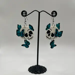 Blue butterfly skull polymer clay earrings