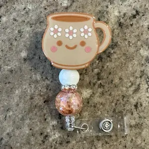 BADGES REEL - Adorable Coffee Cup Design with Floral Accents and Glitter Bead Detailing for Unique Identification