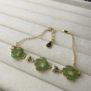 <PingEast jewelry > HeTian Jade bracelet 925 Sterling Silver Bracelet featuring natural Hetian Jade four-leaf clover charms, interspersed with yuanbao (ancient gold ingot) accents