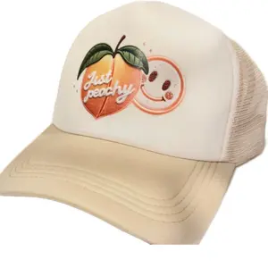 Ember and Edge Clothing Just Peachy Trucker Hat with Peach and Smiley Face Design for Casual Wear