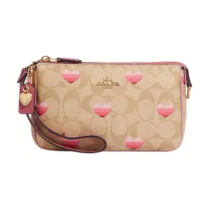 COACH Nolita 19 Classic Monogram Heart Print Zip Top Crossbody Clutch Bag for Women in Brown and Pink