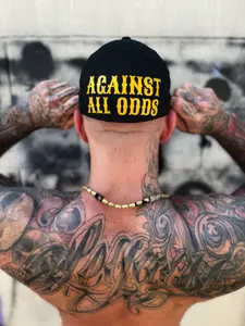 AGAINST ALL ODDS BACK STYLE FLEXFIT COTTON HAT