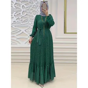 Polyester maxi dress with a polka dot print, modest design featuring a ruffled hem, elegant long sleeves, pleats, a keyhole back, and a crew neckline—waist-cinched—Green Chic