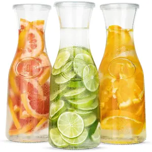 Glass Carafe Pitchers, by Kook, Large Carafe - set of 3, Beverage Dispensers, Clear Jugs For Mimosas, Water, Wine, Milk and Juice, with Plastic Lids, 50 oz Dishwasher Safe