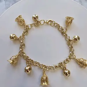 goldplated bracelet with bells Pulso laminado en oro con cinco cascabeles y cinco campanas