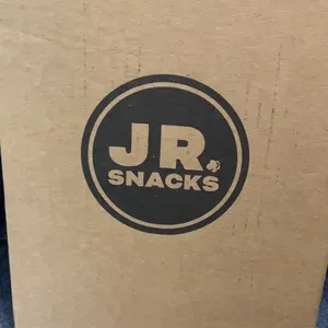 Junior Snacks Co. Hot Cheddar Popcorn; Yellow Cheddar meets our Spicy Red Seasoning