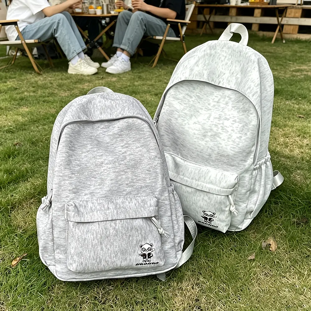Casual backpack, made of soft fabric with ample storage space for everyday use, featuring adjustable shoulder straps and a versatile design with multiple pockets—perfect for daily use, travel, school, and outings.
